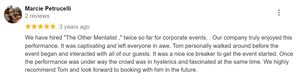 A customer review of a business with a picture of a man and a woman who hired a corporate mentalist for their event.